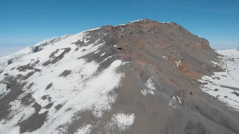 Kilimanjaro and the final path to the highest point in Africa aerial Stock-Footage 121978948