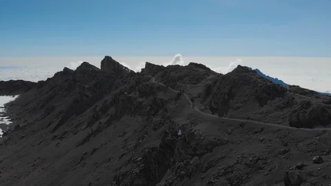 Kilimanjaro and the path to the summit below Stella Point aerial Stock-Footage 121978611