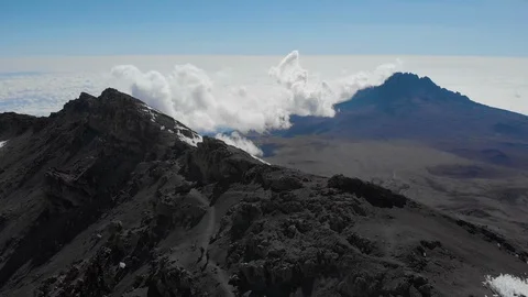 Kilimanjaro fly by over the ridge aerial Stock Footage