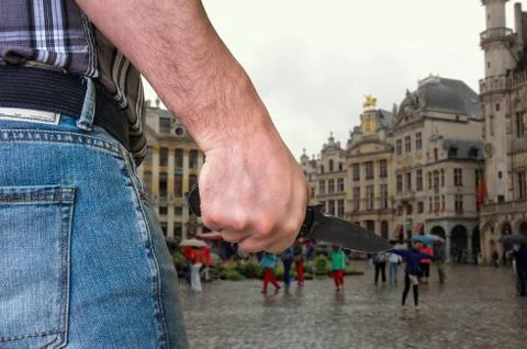 Killer is attacking with knife on crowd of people on the street - murder and cri Stock Photos