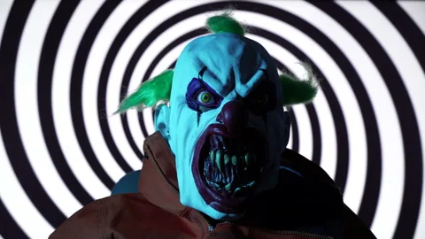 Killer Clown against rotating Monochromatic spiral background Stock Footage 222362291