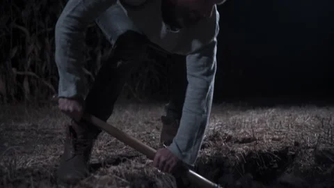 Killer digs grave at night. Stock Footage 161919066