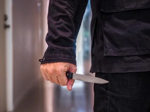 Killer man is attacking with knife Stock Photos