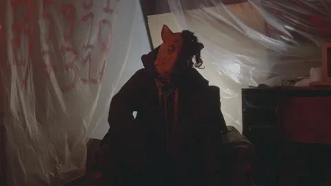 The killer or the the executioner in the mask of an animal, a boar or pig in the Stock Footage 237338116