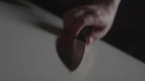 Killer Picking Up a Knife Stock Footage 208803826