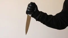 Hand in leather gloves holding knife — Stock Photo © kunertus #57557275