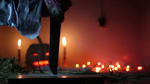 Killer Stabs Sharp Hunting Knife in the Board, in Halloween Stock Footage 119282328