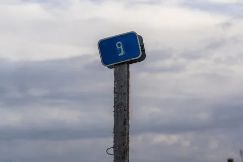 A kilometer marker by the road. 9th kilometer, road sign Stock Photos