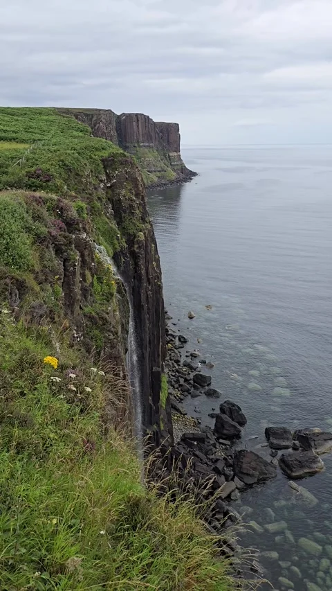Kilt Rock basalt cliffs and Mealt Falls waterfall, Isle of Skye, Scotland Stock Footage 333129921