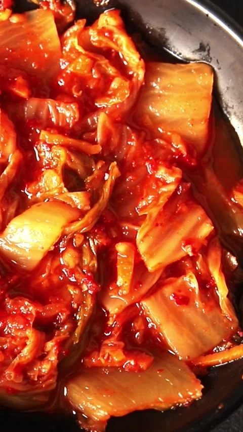 Kimchi pickled cabbage salad spicy savory vegetables fresh delicious Stock Footage 310545756