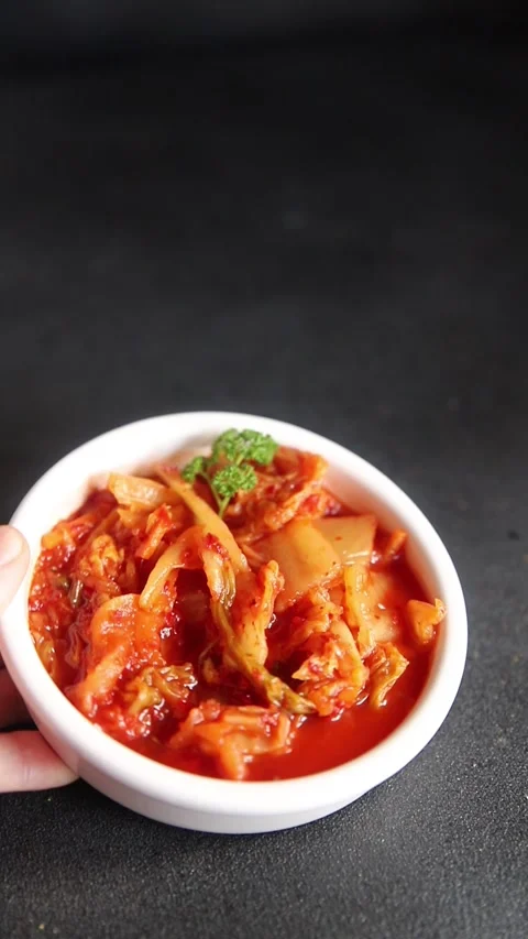 Kimchi pickled cabbage salad spicy vegetables fresh gourmet food Stock Footage 311465239