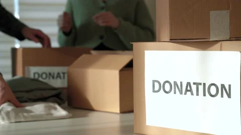 Kind people prepares packing box for shipment to refugees in Ukraine Stock Footage 190624088