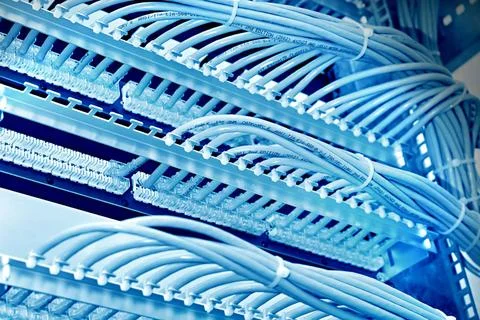 Kind of wiring closet patch panels with 6-th category in the background ki... Stock-Fotos