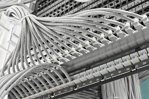Kind of wiring closet patch panels with 6-th category in the background ki... Stock-Fotos