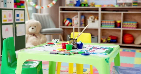 Kindergarten, art and table in empty classroom for education, learning and Video stock 306895830