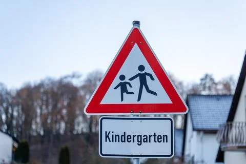 Kindergarten warning sign cautioning drivers about children Stock Photos