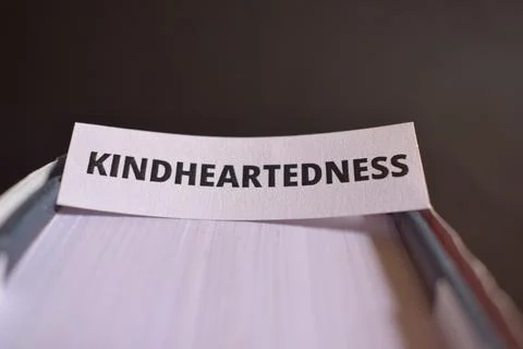 Kindheartedness Paper Tab Between Book Pages Symbolizing Kindness, Care and.. Fotos Stock