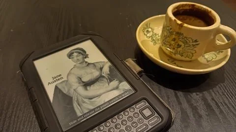 Kindle ebook reader with a cup of coffee in a cafe Stock Photos