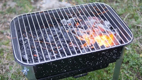 Kindle the fire in the grill Stock Footage 86171866