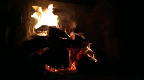 Kindled fireplace in the evening Stock Footage 220556709
