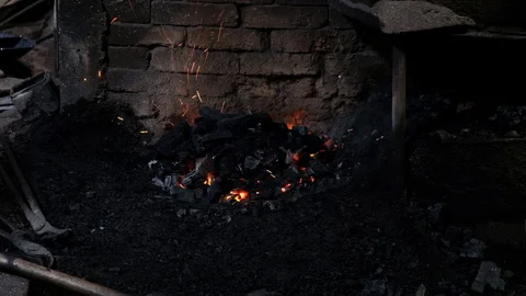 Kindling fire in the blacksmith's workshop Stock Footage 130144520