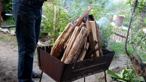Kindling the fire in the brazier Stock Footage 90803093
