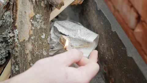 Kindling the fire in the grill Stock Footage 129271130