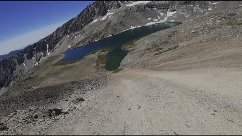Kinetic FPV Drone Swoop: High Alpine Ridge to Goat Lake Basin - Pioneer Mountain Stock Footage 331897498