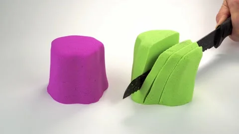 Kinetic sand cutting with a knife on a w... | Stock Video | Pond5