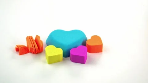 Kinetic sand cutting with a knife on a white background. ASMR sounds. Stock Footage 258786397