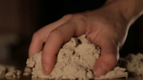 Kinetic sand in a hands Stock Footage 84170204