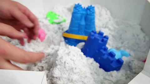 Kinetic sand possibilities demonstrating Video stock 53807528