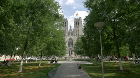 King Baudouin bust statue and St Michael and St Gudula Cathedral in Brussels Stock Footage 59874770