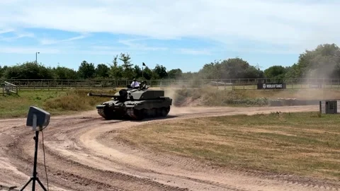 King Charles rides in Challenger 2 tank at The Tank Museum in Bovington Stock Footage 338340672