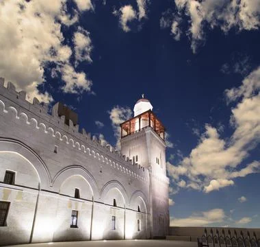 King Hussein Bin Talal mosque in Amman (at night), Jordan.  Against the clouds Stock Photos