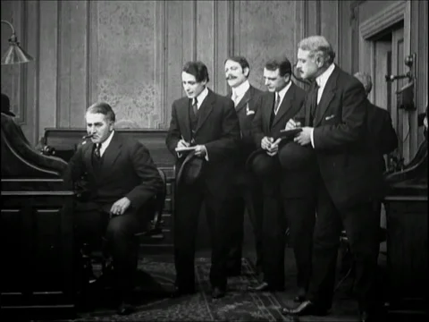 King interact with men in his office - 1909 Stock Footage 95181809