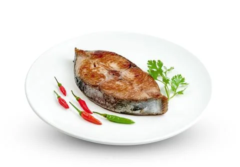 King mackerel or spotted mackerels steak with dish isolated on white backgr.. Stock Photos