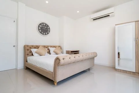 King size bed and dressing table in bedroom of house, villa, apartment and co Stock Photos