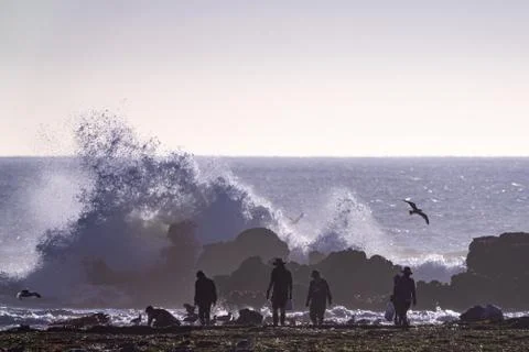 King Tide waves tide pooling in Half Moon Bay California at low tide Stock Photos