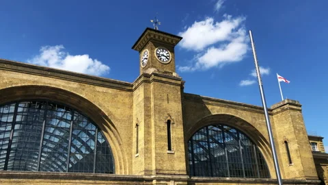 Kings Cross train station clock tower and facade. London UK. Stock Footage
