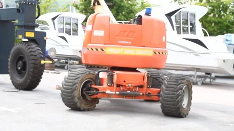 Kingswear, Devon, England: Man operates hydraulic crane in Darthaven marina yard Stock Footage 89940928