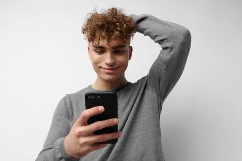 Kinky guy talking on the phone posing emotions Lifestyle unaltered Stock Photos