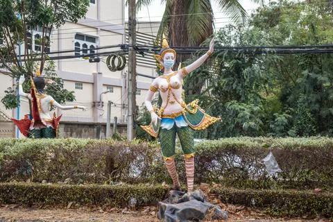 Kinnaree put a statue on the roadside to warn people to prevent the spread of Stock Photos