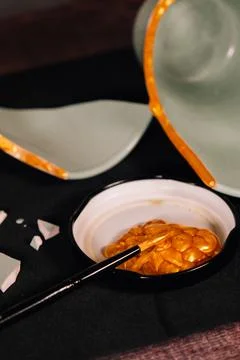 Kintsugi concept. Broken pottery pieces. Stock Photos