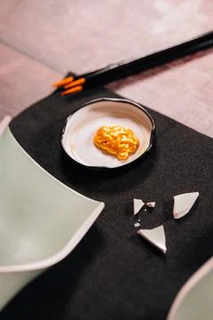 Kintsugi concept. Gold glue to join broken ceramics. Stock Photos