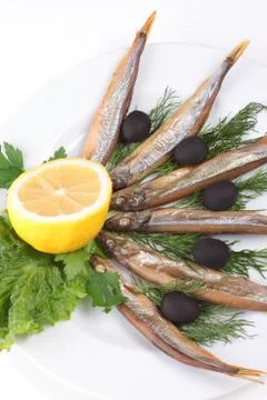 Kipper fish on composition with vegetables Stock Photos