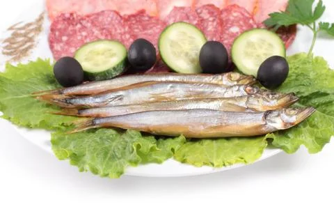 Kipper fish on composition with vegetables Stock Photos
