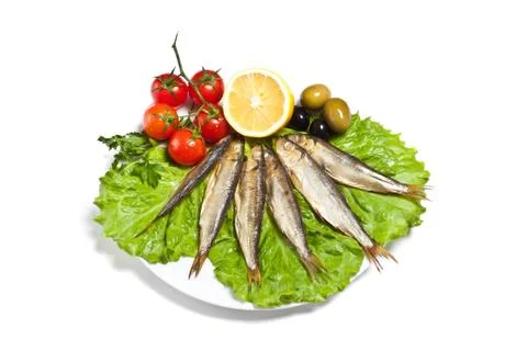 Kipper fish on composition with vegetables Stock Photos