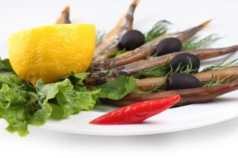 Kipper fish on composition with vegetables Stock Photos