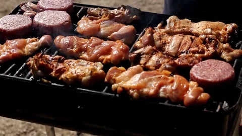 Kishon park - BBQ flipping meat Stock Footage